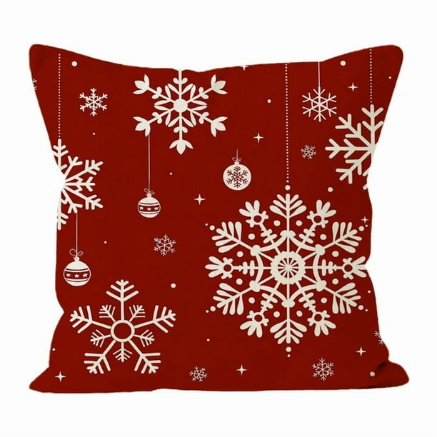 Fundas de almohada navideñas con fondo rojo y diseño de copos de nieve