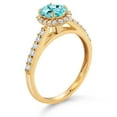 thumbnail image 3 of Gem Stone King 10K Yellow Gold Blue Apatite and White Lab Grown Diamond Halo Engagement Ring for Women (1.13 Cttw, Gemstone, Oval 7X5MM), 3 of 4