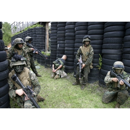 Marines set up security while waiting to move to an extraction site during a raid Canvas Art - Stocktrek Images (34 x