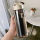 thumbnail image 1 of Botella de agua deportiva de 550 ml con asa de transporte y rejillas mezcladoras integradas, a prueba de fugas, ideal para gimnasio, fitness, viajes, hervidor de plástico., 1 of 6