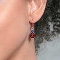 thumbnail image 3 of Gem Stone King 18K Rose Gold Plated Silver Red Garnet and Blue Created Sapphire Dangle Earrings for Women (6.68 Cttw, Gemstone January Birthstone, Oval 10X8MM, Trillion 5MM), 3 of 4