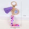 thumbnail image 1 of Llavero con 26 letras en inglés de estilo europeo y americano de moda, colgante con borlas y letras de piedra de color epoxi de cristal, 1 of 6
