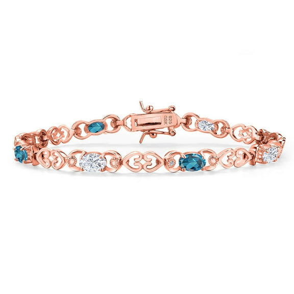 Gem Stone King 18K Rose Gold Plated Silver White Moissanite and London Blue Topaz and Lab Grown Diamond Bracelet for Women | 4.41 Cttw | Gemstone Birthstone | Oval 6X4MM | Length 7.25 inches