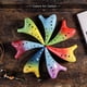 thumbnail image 2 of Ocarina de 12 agujeros en tono Do alto, diseño estrellado con acabado esmaltado, incluye partitura, funda protectora y cordón, ideal para amantes de la música., 2 of 6