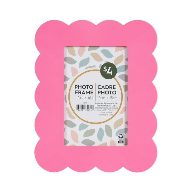 Pink scalloped decorative tabletop picture frame designed to hold 4x6 inch photos.