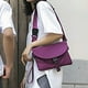 thumbnail image 5 of Mochila bandolera para mujer y hombre con orificio para auriculares, bolso de pecho, bolso de día para viajar, deporte, senderismo. Bolso impermeable de hombro único en morado., 5 of 7