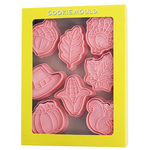 juego de cortadores de galletas de hojas tropicales, 8 piezas molde cortador de galletas plástico 3d prensable diy sellos de galletas moldes de estampado hoja de palma monstera suministros para hornear de cocina molde de pastelería fondant blanco, vista frontal centrada de ocho cortadores rosados con siluetas de hojas, mazorca, calabaza, gorro y animal; plástico liso con cavidades para estampado, presentados en caja amarilla con ventana, también adecuados para fondant y manualidades.