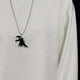 thumbnail image 3 of Juego de collares con colgante de dinosaurio Strade Fareast Limited 4 piezas Negro, 3 of 5
