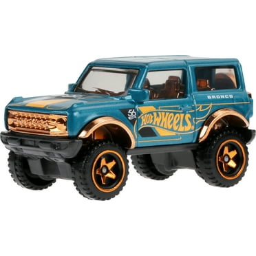 Hot Wheels 1:64 Scale Die-Cast Toy Car or Truck with Turquoise- & Copper-Colored Deco (Styles May Vary)