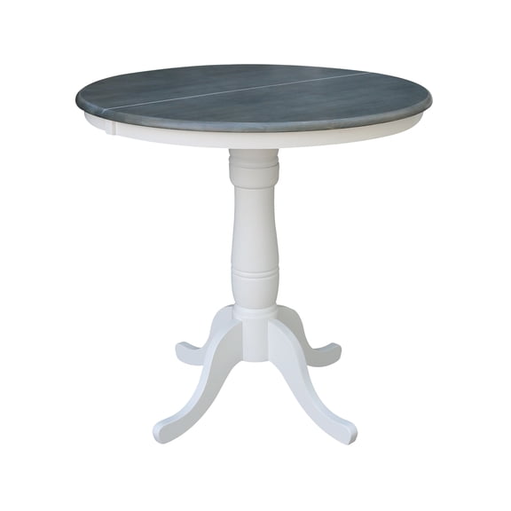 36" Round Solid Wood Pedestal Counter Height Dining Table With 12" Extension Leaf in White/Heather Gray by International Concepts