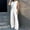 White, variant on HOZADOIE Womens Blazer Suits 2 Piece Set Business V Neck Sleeveless Button Front Blazer Vest Pleated Slightly Flared Wide Leg Blazer Pants Sleek Office Work Suit Set