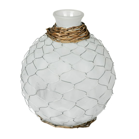 Vickerman 7.5" Frosted Glass Vase Chicken Wire Wicker. It features a frosted finish on the glass, silver chicken wire, and natural tone wicker accents on the top and bottom. It measures 7.5 inches tal