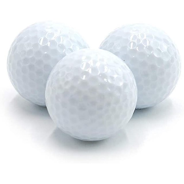 3 pelotas de golf que brillan en la oscuridad.