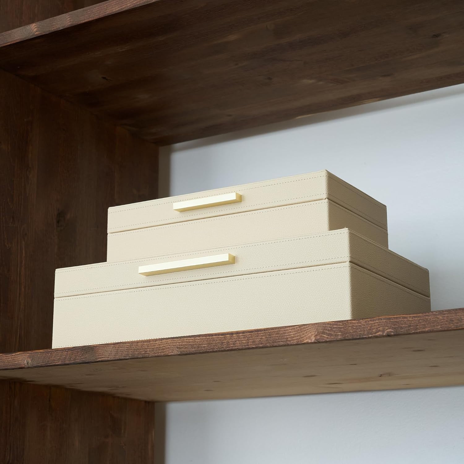 Decorative storage boxes with lids – a two-piece set of elegant PU leather organizer boxes perfect for bookshelf home décor – securely and stylishly store photos, documents, and keepsakes.