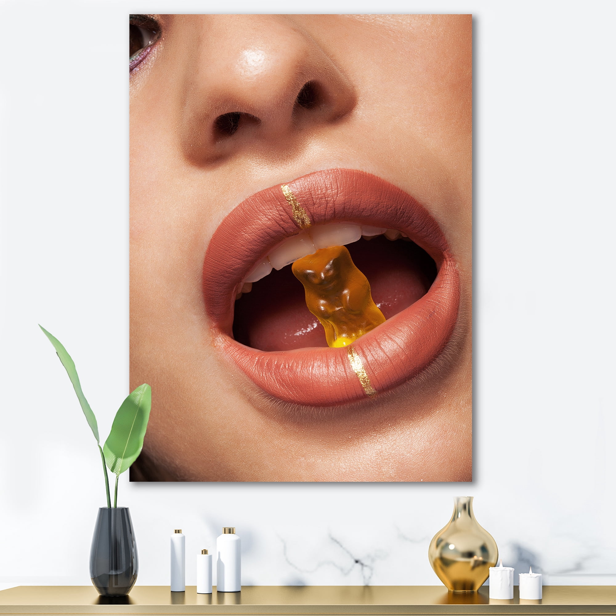 Designart ' Close Up VIew of Female Lips Biting Gummy Bear ' Modern Canvas Wall Art Print
