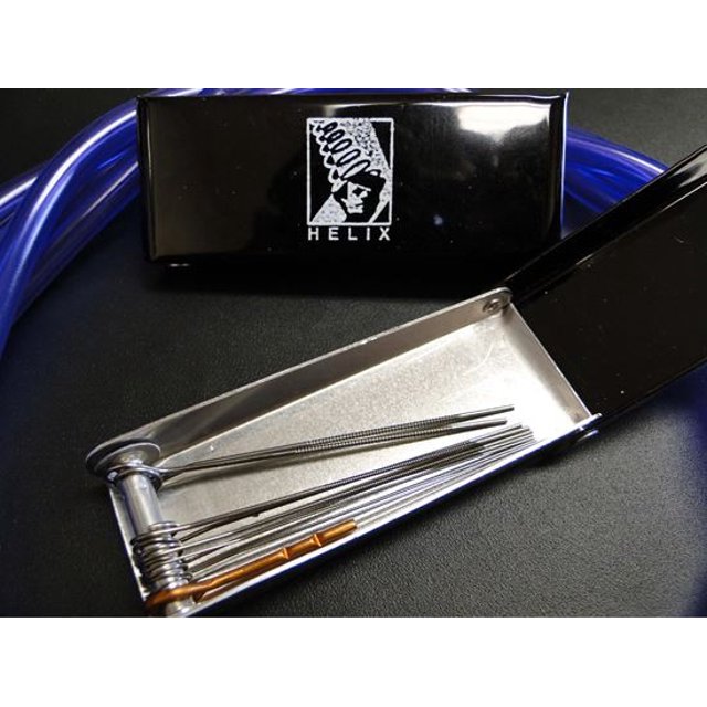 Helix Racing Carburetor Metering Jet Tool 388-0611 Universal, a specialty automotive tool with a compact design, 10 cleaning needles, and a storage case. Ideal for cleaning clogged jets and passageways inside carburetors, ensuring optimal performance for powersports machines on road, dirt, water, and snow. Includes a durable black storage case with Helix branding.