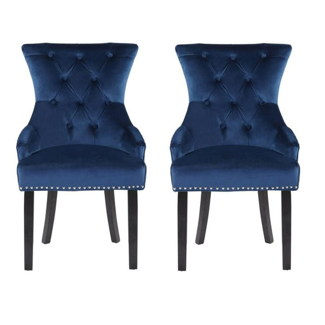 Set of two Plata Import Isabella Chairs in blue velvet with tufted backs and black wooden legs.