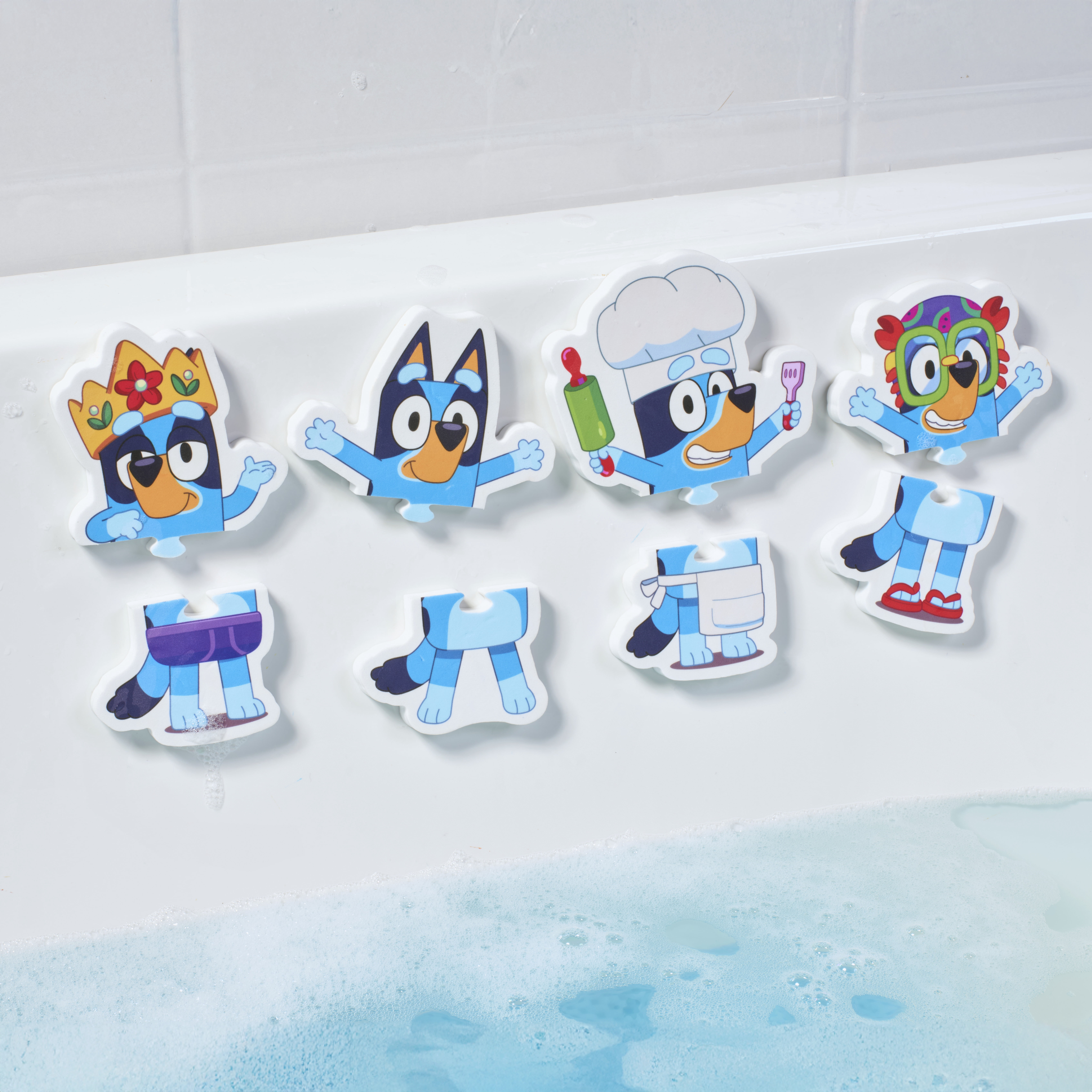 TOMY Toomies Bluey Bath Puzzle - Includes Mesh Bag Bath Toy Storage with Suction Cups - 8 Count - 18 Months and up