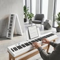thumbnail image 2 of Carina Piano Keyboard, 88 Keys Full Size Semi Weighted Foldable Piano, Portable Electronic Keyboard Piano, Sustain Pedal, Keyboard Stickers, Music Stand and Piano Bag (White), 2 of 4