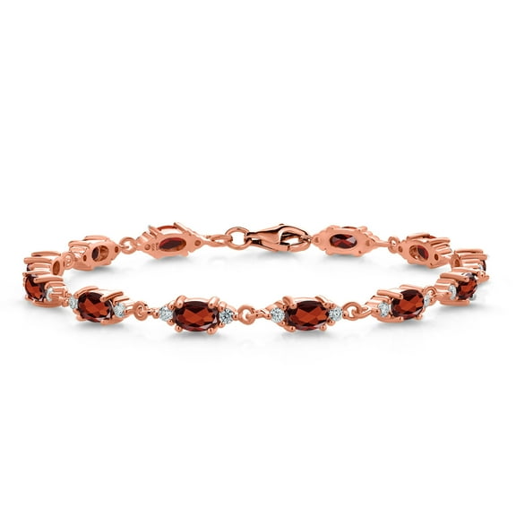 Gem Stone King 18K Rose Gold Plated Silver Red Garnet and White Moissanite Tennis Bracelet for Women (7.75 Cttw, Gemstone Birthstone, Oval 6X4MM, 7.5 inch)