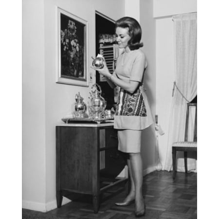Side profile of a young woman cleaning a silver tea set Canvas Art -  (18 x (The Best Way To Clean Silver)