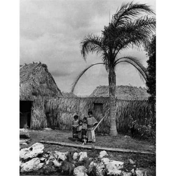 USA Florida Tamiami Trail Four Seminole Girls Standing Together in Front of Hut Poster Print - 18 x 24 in.