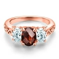 thumbnail image 3 of Gem Stone King 18K Rose Gold Plated Silver Red Garnet and Sky Blue Aquamarine Filigree Style 3 Stone Ring for Women (2.53 Cttw, Oval 8X6MM and 6X4MM, Size 8) (Size 8), 3 of 6