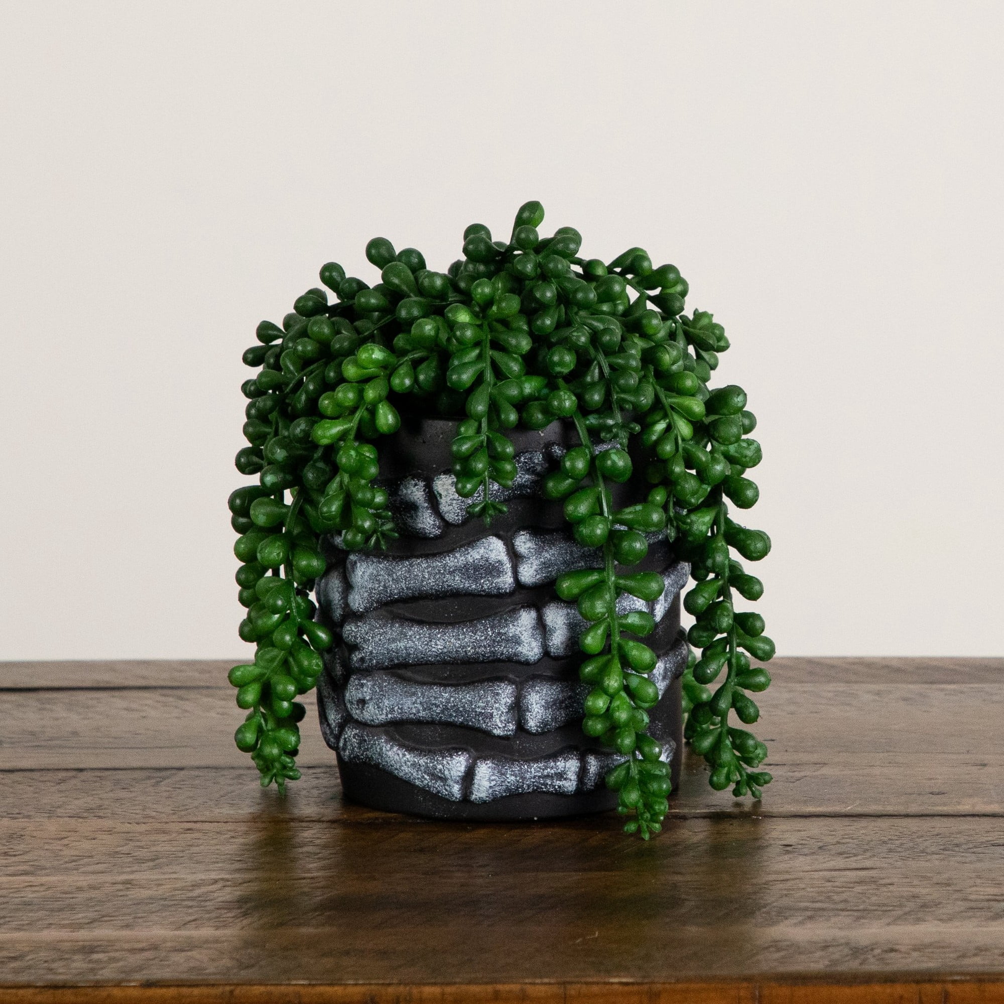 7in. Artificial Halloween String of Pearls in Skeleton Hand Planter