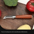 thumbnail image 4 of Premium High-End Rosewood Handle and 304 Stainless Steel Serrated Blade - An Ultra-Sharp Rotating Peeler for Potatoes, Fruits, and Vegetables, Ergonomically Designed for Easy Peeling., 4 of 11