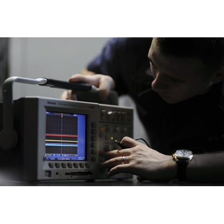 Electronics Technician troubleshoots an oscilloscope Canvas Art - Stocktrek Images (34 x 23)
