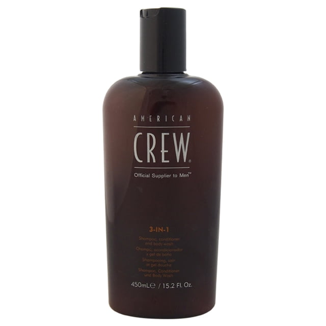 american crew champú y acondicionador y gel de baño champú y acondicionador y gel de baño 3 en 1 15.2 oz botella frontal marrón con tapa abatible y logo CREW, envase de 450 ml indicado como 3‑in‑1 para hombres que elimina suciedad y sudor según especificación; formato compacto frecuentemente usado para llevar en viajes.