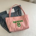 thumbnail image 1 of Bolso de lona para estudiantes, bolso de mano informal de moda de nueva tendencia 2025 para damas, bolso de tela de gran capacidad con letras, 1 of 5