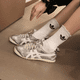 thumbnail image 2 of Zapatos casuales de cuero México 66 para hombre y zapatillas deportivas para mujer, Plateado/Blanco, 2 of 6