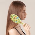 thumbnail image 2 of Roaring Dinosaur Hair Brush - Anti-Frizz & Smoothing, Nature-Inspired Print, Ideal for Stylists & Beauty Enthusiasts, 2 of 5