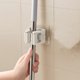 thumbnail image 4 of Soporte de pared para fregona con adhesivo resistente | Organizador de escobas sin taladro para baño y lavadero | Colgador resistente de acero inoxidable para rastrillo y pala | Paquete de 1, 4 of 7