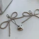 thumbnail image 4 of Llavero de corazón de lazo blanco plateado para mujer, llavero de mochila con lazo de perla, joyería hecha a mano, adorno de bolsos, colgantes Gif, 4 of 5