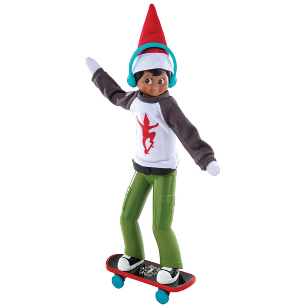 The Elf on the Shelf MagiFreez Holly Jolly Ollie Skateboard Set for Your Scout Elf - Includes Magical Standing Pants, elf- Sized Long Sleeve tee, Headphones and Skateboard