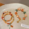 thumbnail image 4 of Exquisite Bracelet Featuring a Little Pumpkin Motif on Golden Silk, 4 of 8