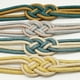 thumbnail image 5 of Sujetadores magnéticos para cortinas con diseño de nudo chino, elegante y práctico, disponible en combinación de café oscuro y beige., 5 of 7