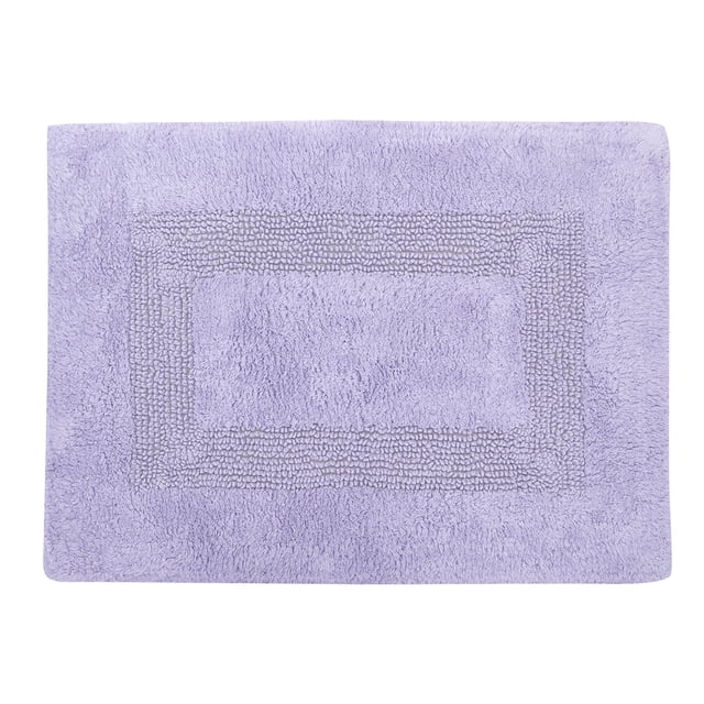 Lilac 100% cotton bath rug measuring 17 by 24 inches with a textured racetrack design