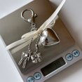 thumbnail image 3 of Charming Keychain: Features a Shiny Silver Heart and a Sweet Bow Detail, 3 of 9