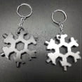 thumbnail image 4 of Herramienta multiusos 18 en 1 con forma de copo de nieve, llave de bolsillo, llave hexagonal, abridor de botellas y llavero multifunción., 4 of 5