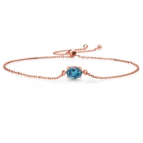 Gem Stone King 18K Rose Gold Plated Silver London Blue Topaz Solitaire Bracelet for Women (1.00 Cttw, Oval Cut 7x5mm)