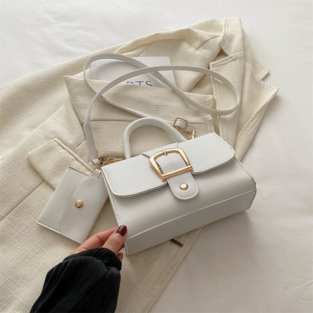 La tendencia popular de este año en bolsos cuadrados pequeños de color caramelo es un nuevo estilo, un bolso de mano retro simple y elegante, un bolso bandolera versátil.