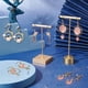 thumbnail image 5 of Kit de 10 pares de pendientes de luna y estrella esmaltados, con dijes de planeta, corazón y gato, color rosa, modernos, para mujer, no plegables., 5 of 9