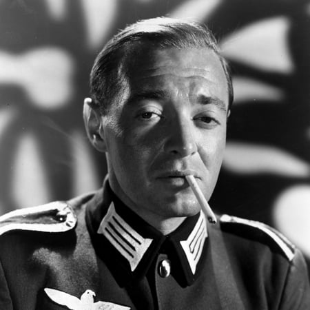 Peter Lorre Smoking Cigarette wearing Rank Official Uniform in Black and White Portrait Photo Print - Item # VARCEL692384