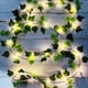 thumbnail image 1 of Hiedra artificial, [1 ud.] Guirnalda de luces de 2 m, plantas artificiales con 20 LED y hojas verdes, guirnalda de luces LED para jardín, patio, hogar, terraza y decoración de bodas., 1 of 5