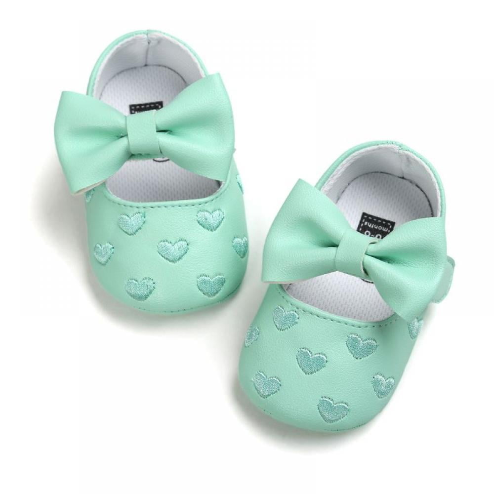 green baby shoes