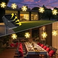 thumbnail image 6 of Solar Christmas Snowflake Lights, 23FT 50 LED 8 Modes Warm White Fairy String Lights  for Outdoor Garden Holiday Party Patio Yard Christmas Decorations, 6 of 8