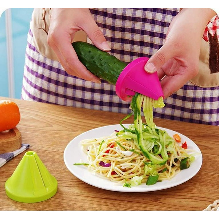 Making zucchini noodles with spiral vegetable slicer Stock Photo